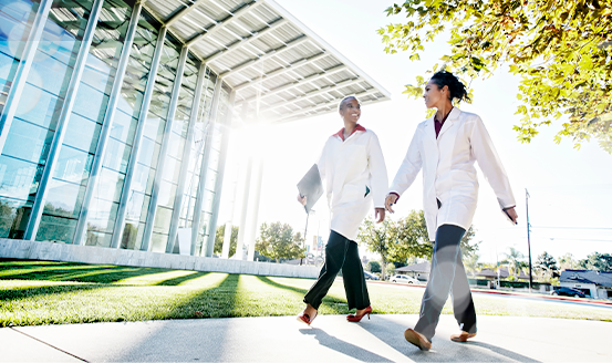 Two female professionals walking together