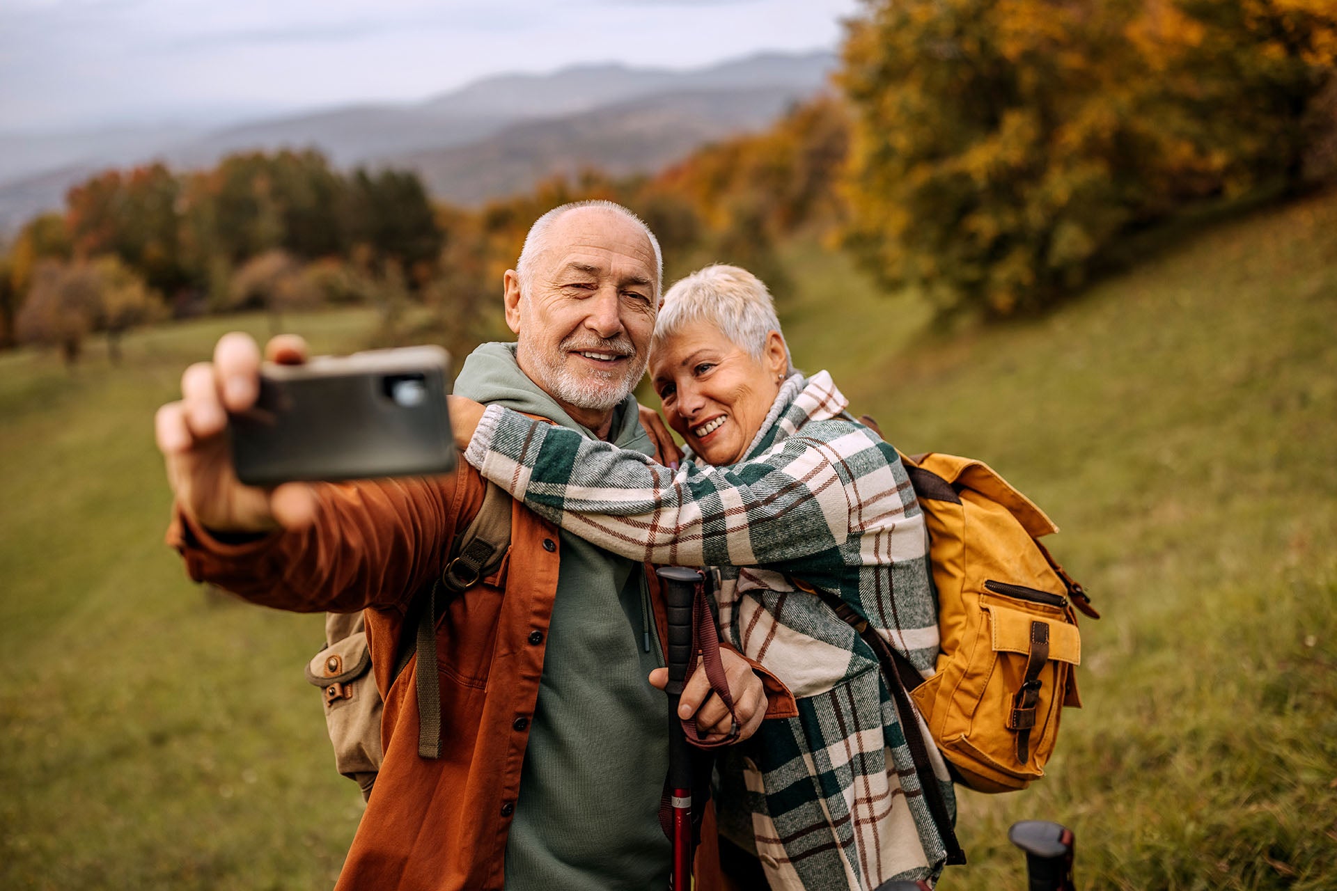 The smiling couple taking selfie