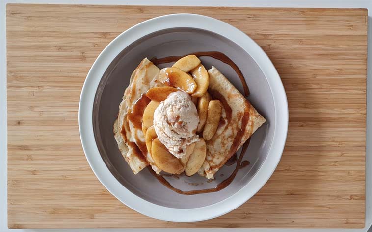 Pancakes with caramelised apple, cinnamon, and ice cream